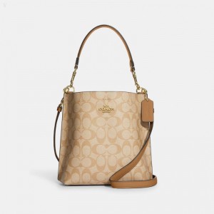 Coach Mollie Bucket Bag 22 In Signature Canvas - Women's Shoulder Bags - Gold / Light Khaki / Light Saddle | BYAV3651
